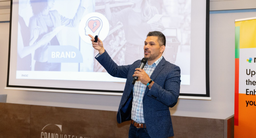 Hassan Rmaile, president and chief executive officer of MCC Label, talks to attendees.